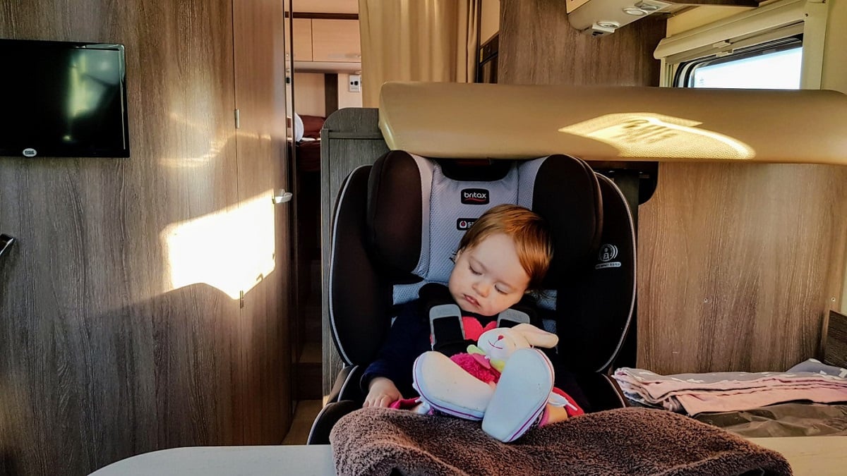 Baby in a car seat in a Wilderness motorhome
