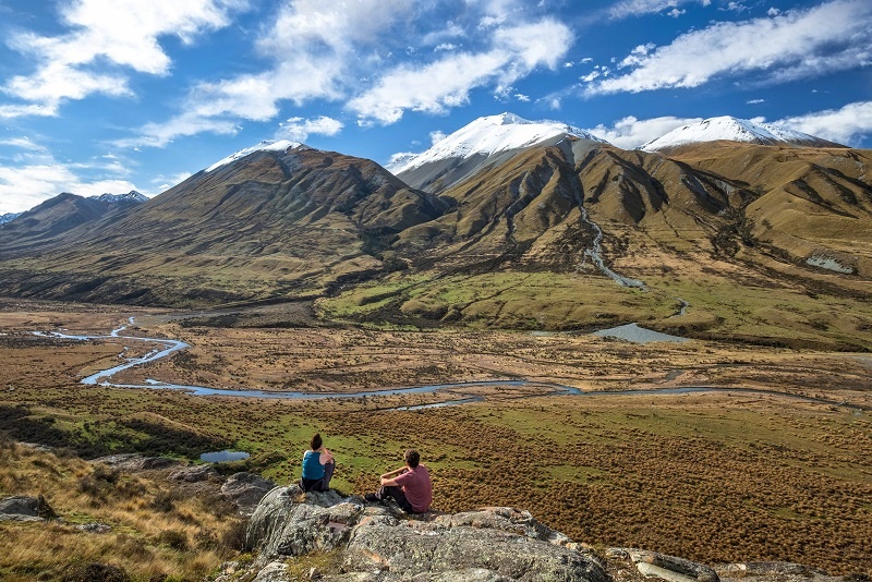Couple gazing at Mount Sunday New Zealand