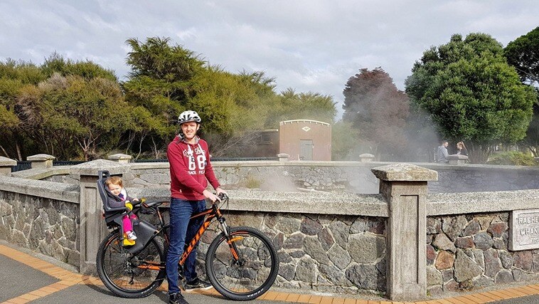 Enjoy a bike ride with your kids while travelling NZ in a campervan