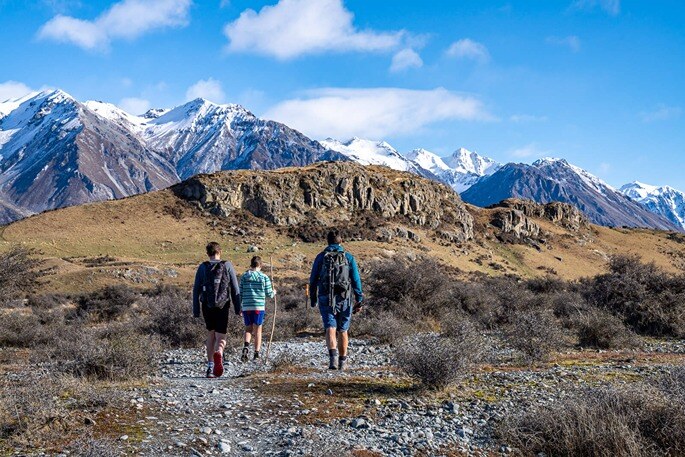 family hiking up Mount Sunday in South Island