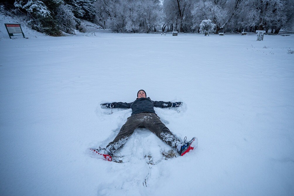 tween enjoying snow at Lake Heron