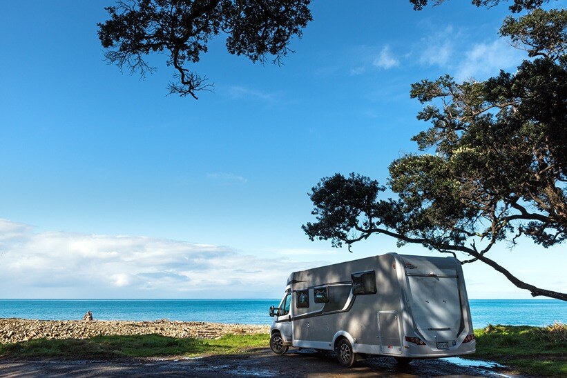 A motorhome parked up at a freedom campsite in Coromandel