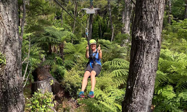 Mary Hamilton riding a zipline at Driving Creek Railway