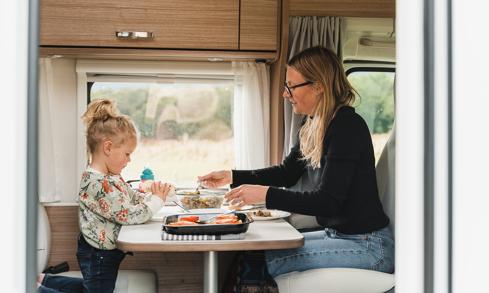 mother and toddler in a Wilderness motorhome