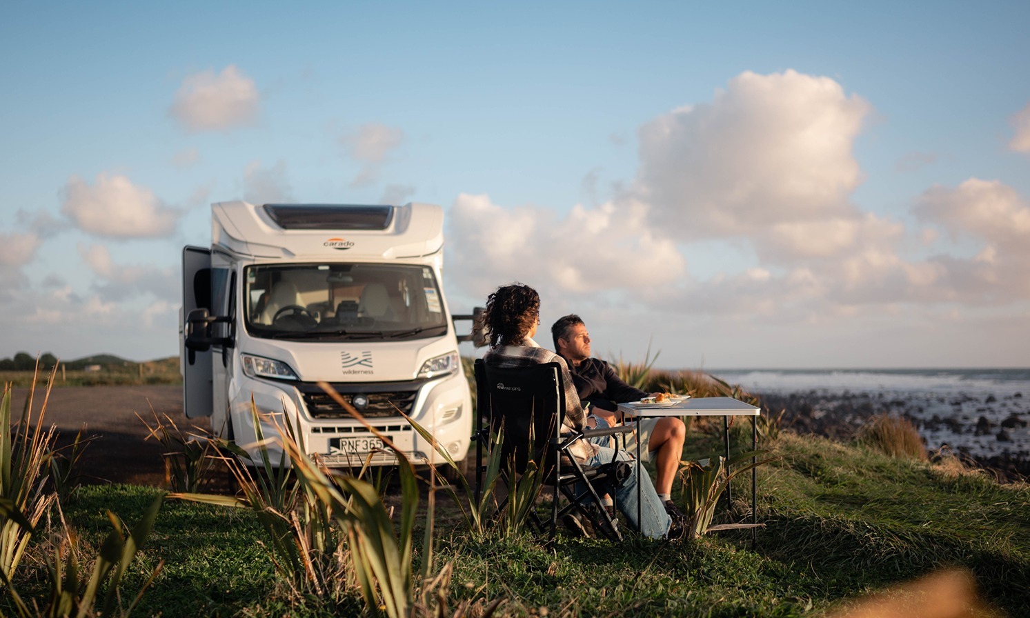 couple freedom camping with Wilderness motorhome