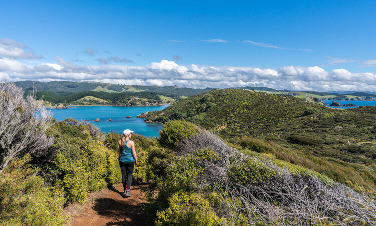 A woman exploring the outdoor during her motorhome trip in New Zealand