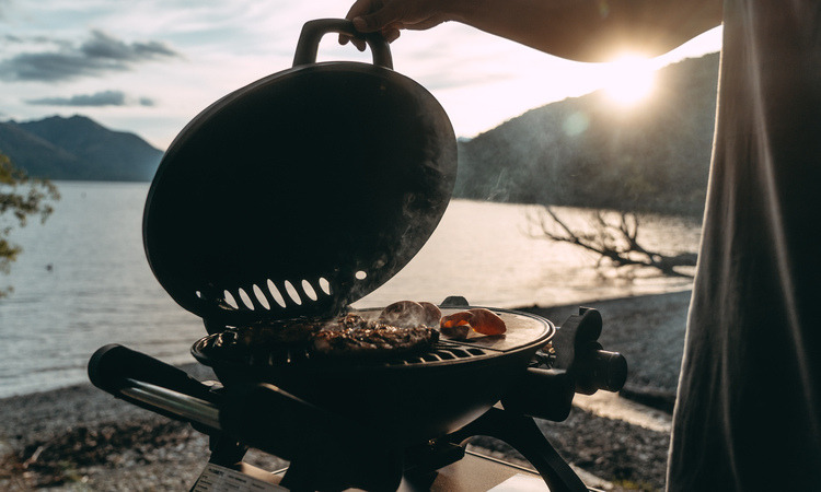 Using a barbecue during a motorhome trip in New Zealand