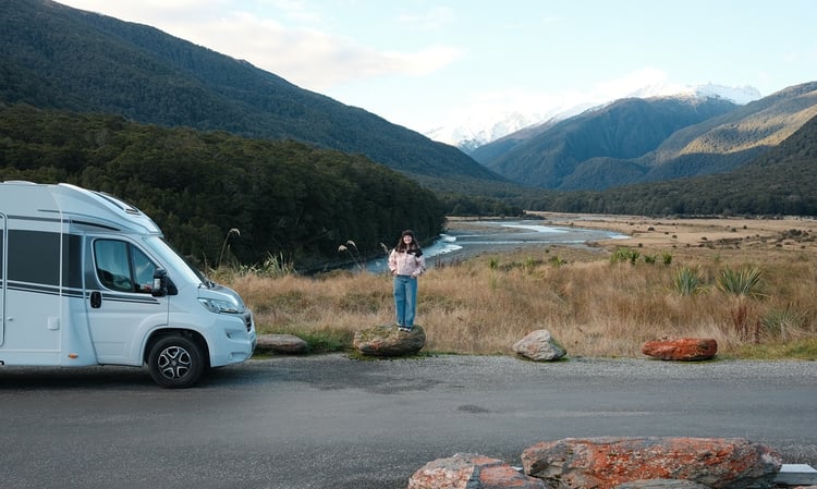 Marissa standing with motorhome