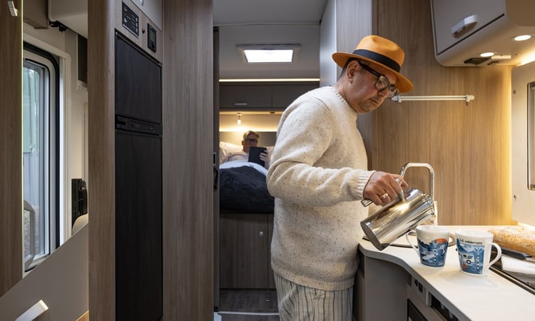 wilderness pouring tea in kitchen