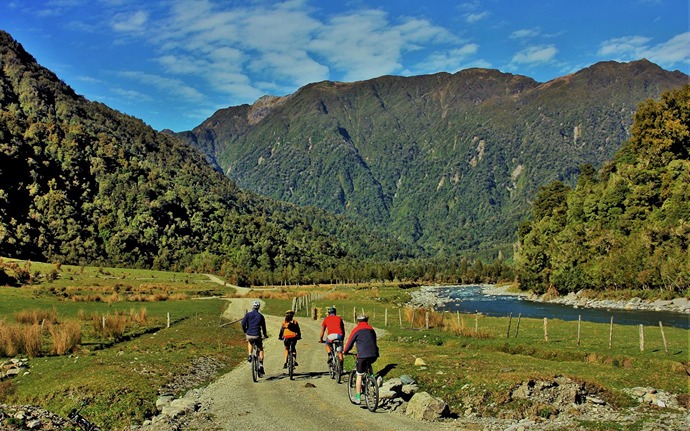 Biking along the Arahura River, West Coast Wilderness Trail (credit Chris Steele)