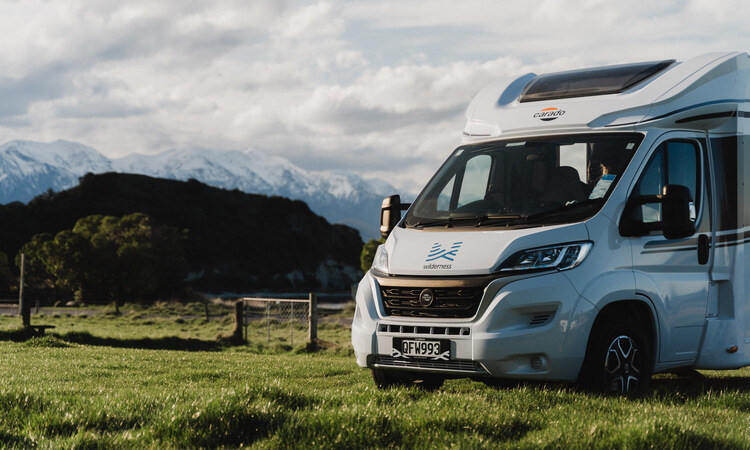 A Wilderness motorhome parked up with a scenic mountain view