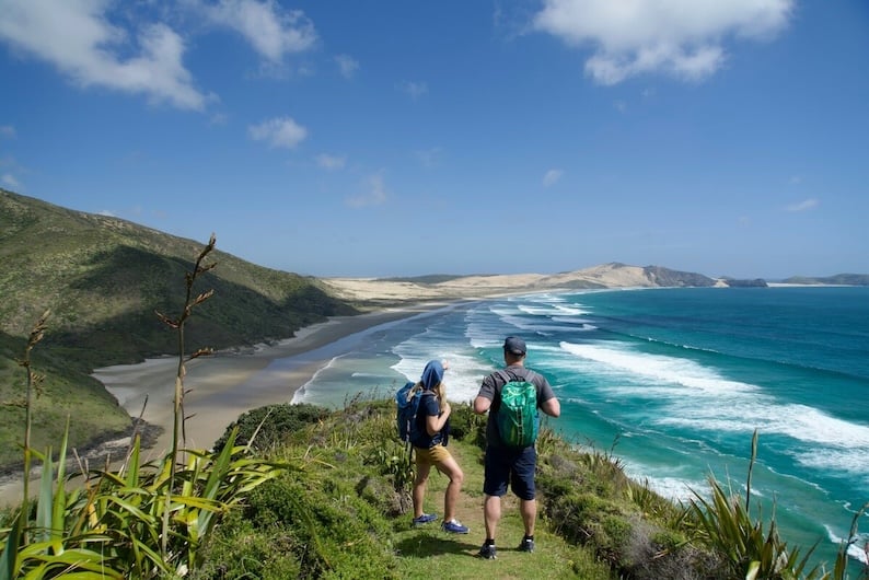 Couple above some Northland beaches admiring the view