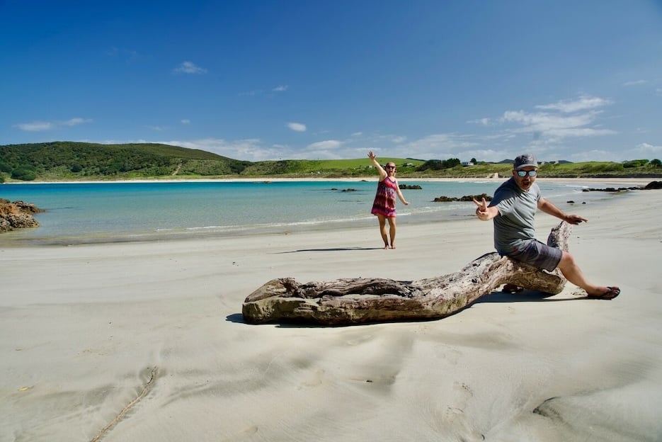 Couple on a beach relaxing and having fun