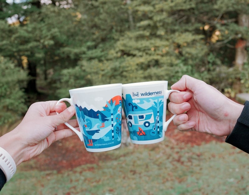 Couple celebrating with Wilderness cups