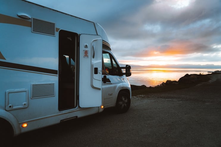 A motorhome in Golden Bay watching the sunset