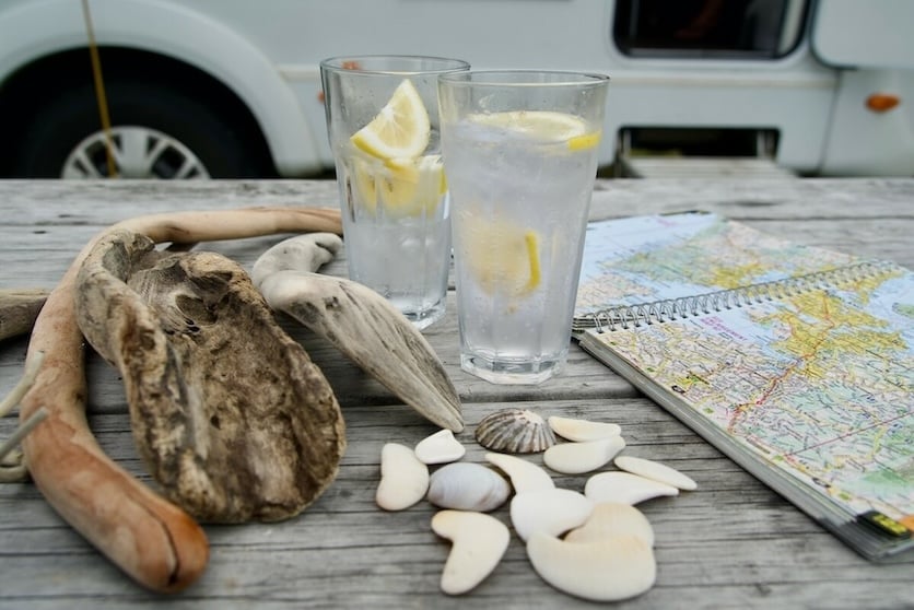 Planning a trip with a map on an outdoor table