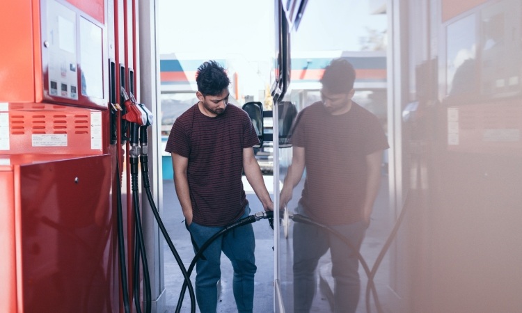 A person filling up motorhome fuel