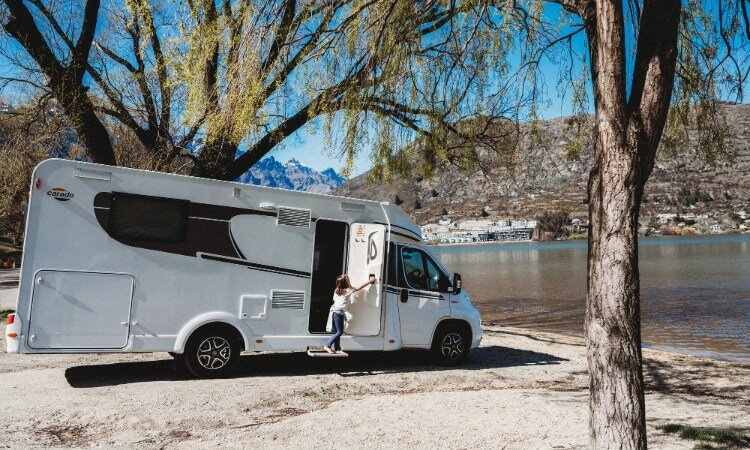 A Wilderness Motorhome parked up in fornt of a lake
