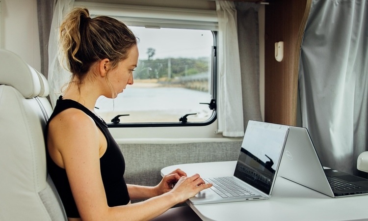 A digital nomad working remotely in a motorhome