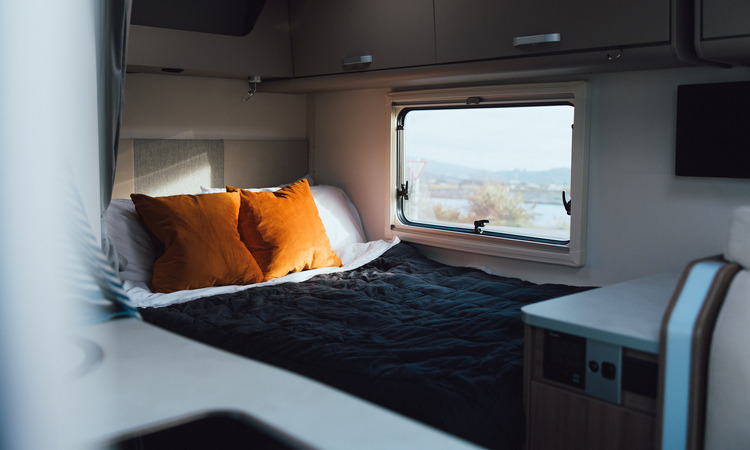 A permanently made-up bed in a Compact for 2 Wilderness motorhome