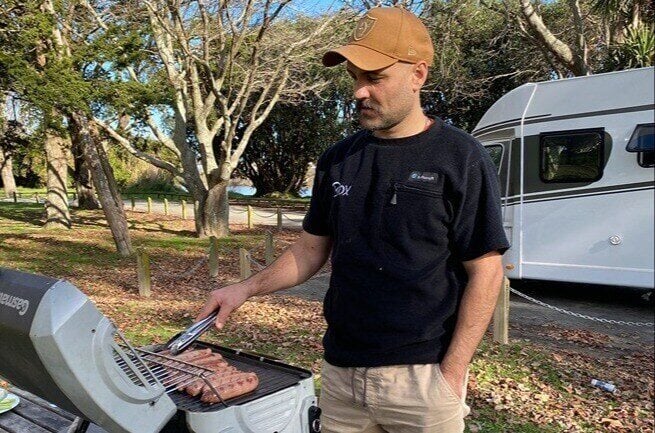 Cooking sausages on BBQ