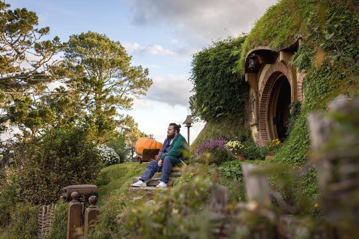 Hobbiton sitting down outside