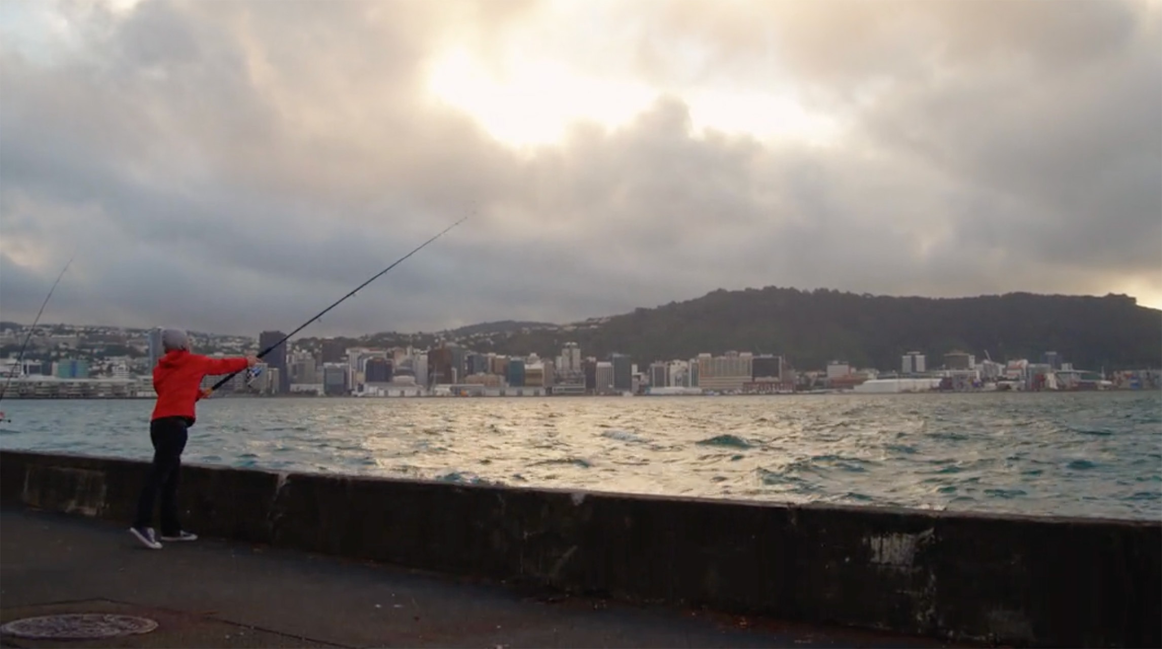 A man fishing at Wellington Harbour