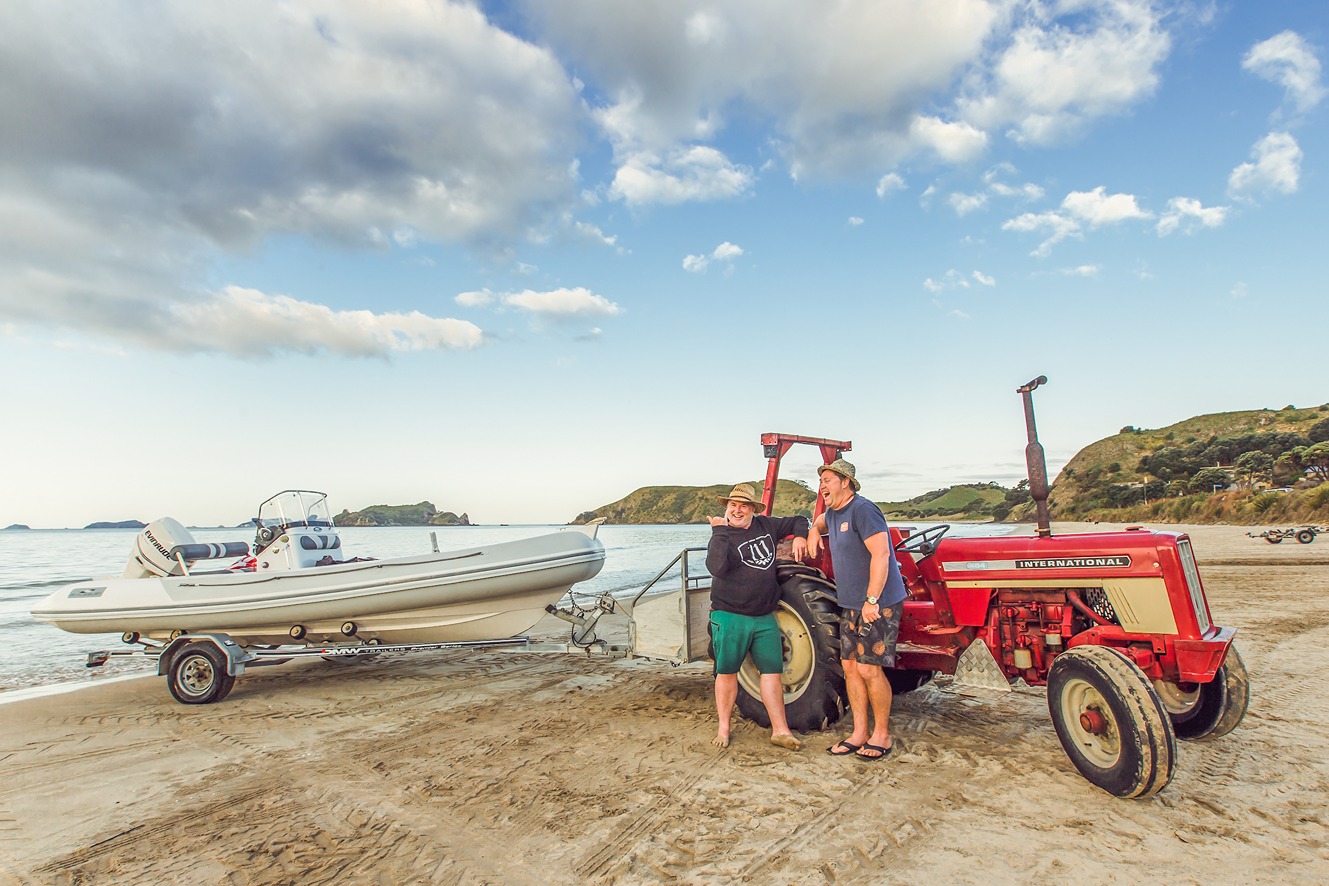 Bringing a boat out to fish at Opito, credit to www.thecoromandel.com | The Coromandel