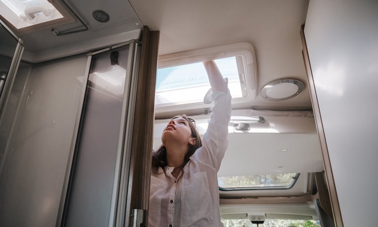Girl opening skylight