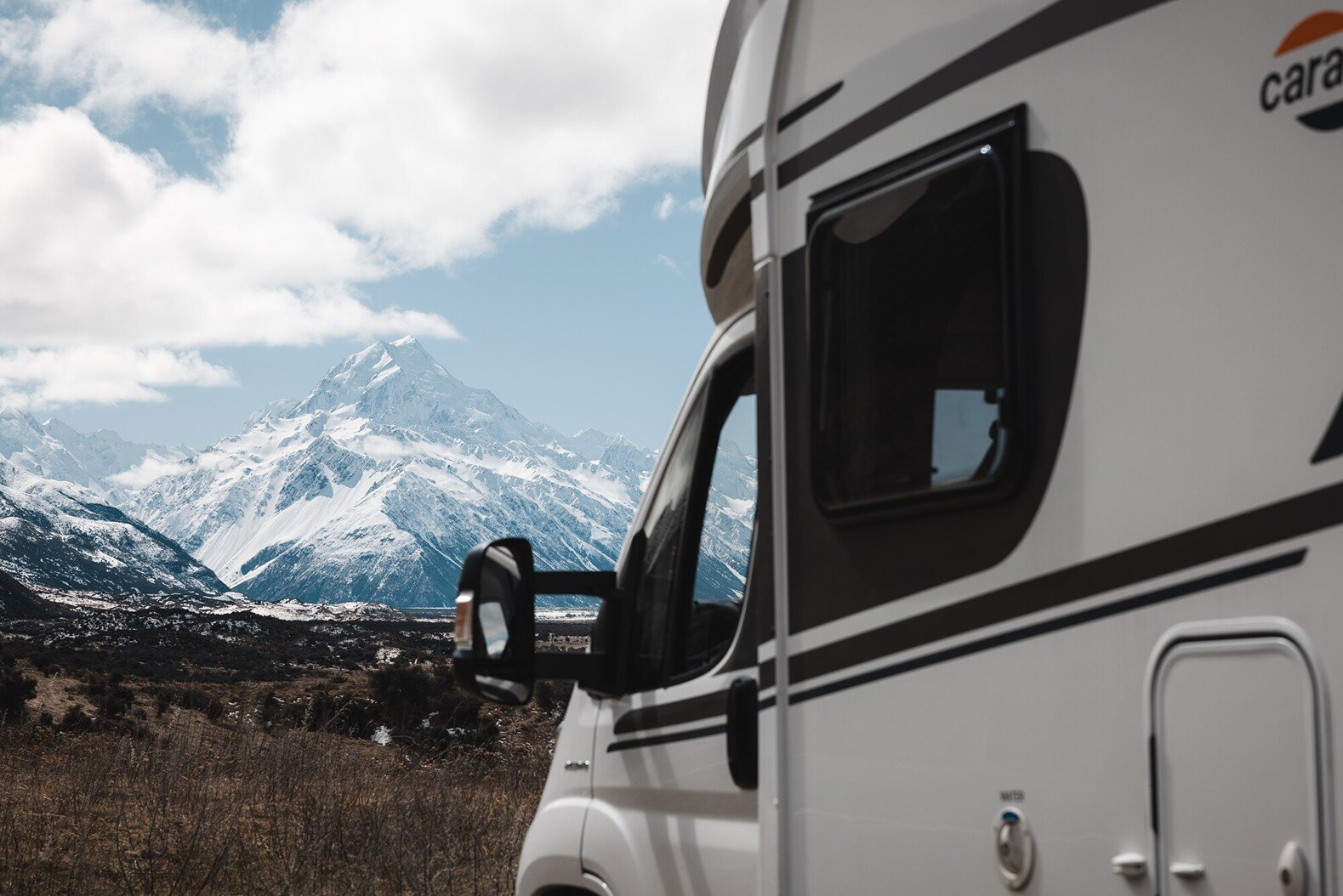 A Compact for 2 parked up with a scenic mountain view