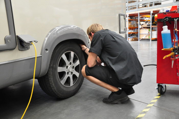 Checking motorhome tyres in the workshop