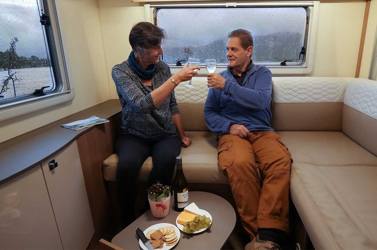 Kathy and Mike enjoying-wine-and-cheese-in-the-Suite-motorhome