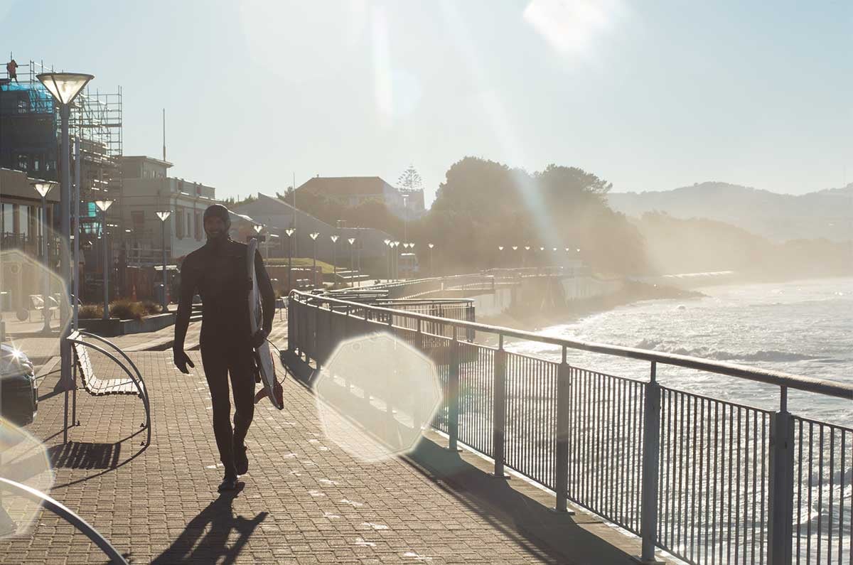 Surfer-walking-at-St-Clair-beach