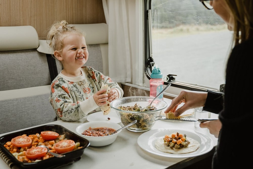motorhome eating dining table toddler woman compact plus wilderness motorhome