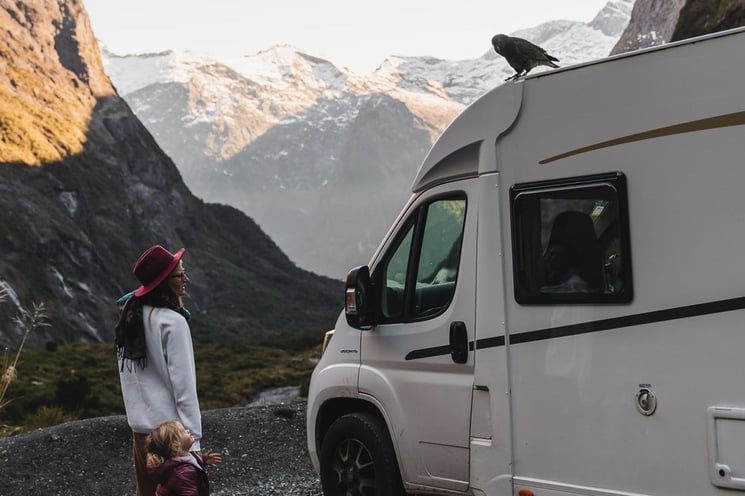 woman toddler family outside motorhome kea bird compact plus wilderness motorhome