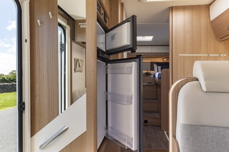 Looking inside a motorhome fridge that can swap between power sources