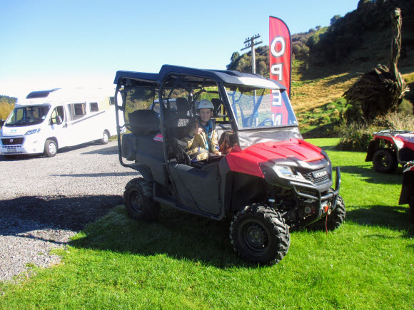 Girl enjoying a 4x4 quad bike ride on her NZ motorhome trip