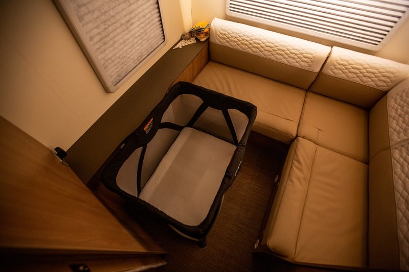 Travel cot in a Wilderness campervan