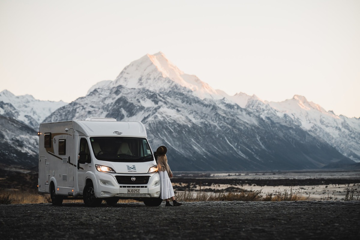 Traveller enjoying a scenic view beside the motorhome